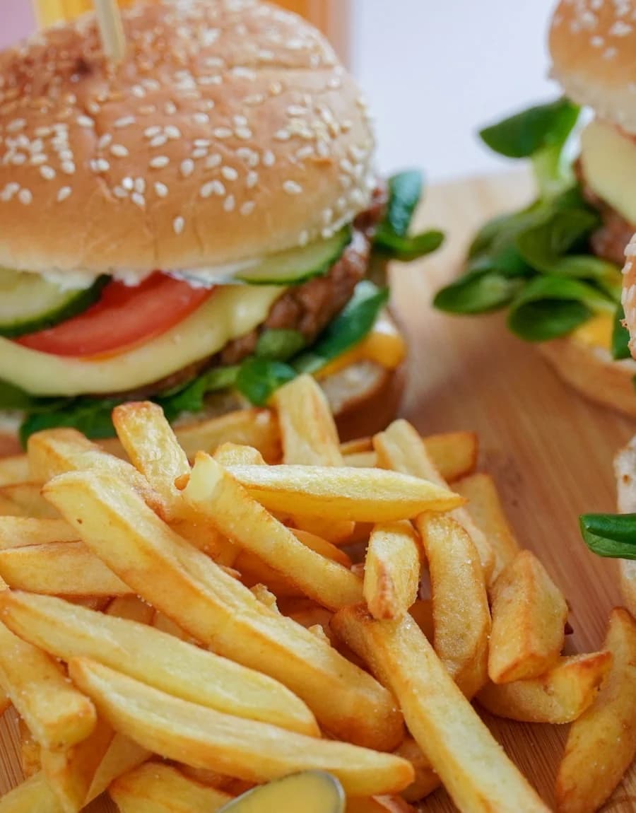 Sesame-bun burger with a basket of fries