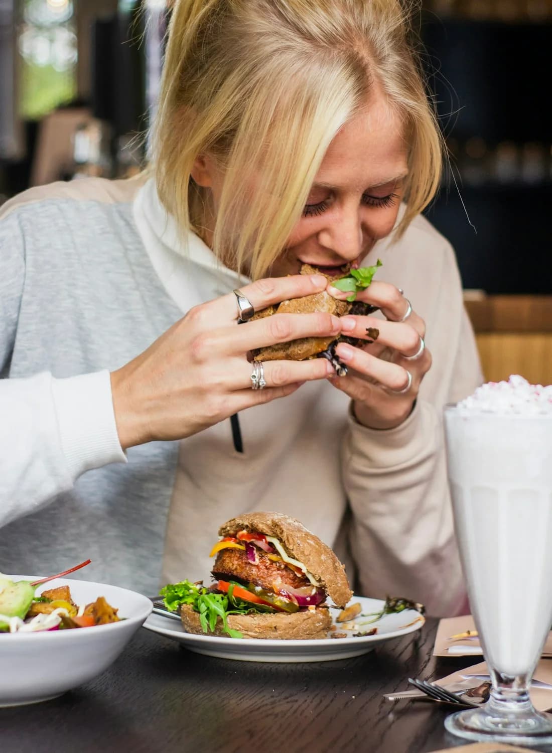 Someone biting into a burger