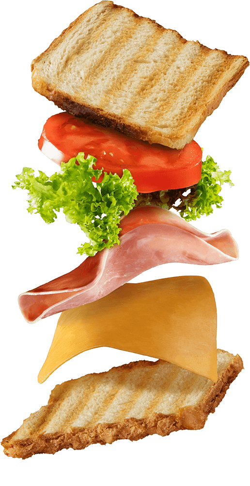 Toasted club sandwich cutout with its layers falling apart mid-air